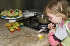 Child Icing Cupcakes