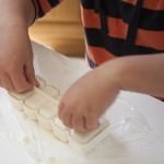 Shaping Nigiri using a plastic mold