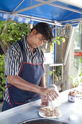 Street Vendor making sweet Roti Cania