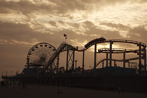 Santa Monica Pier Roller Coaster and Ferris Wheel silhouette Santa Monica Pier Roller Coaster and Ferris Wheel silhouette