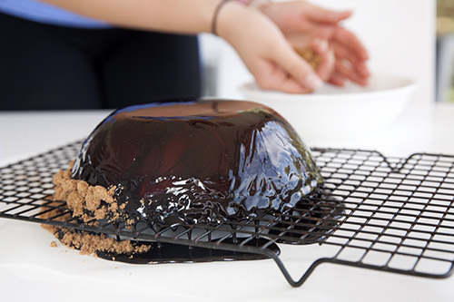 Adding Crushed Specuula cookies to the ganache to finish the presentation