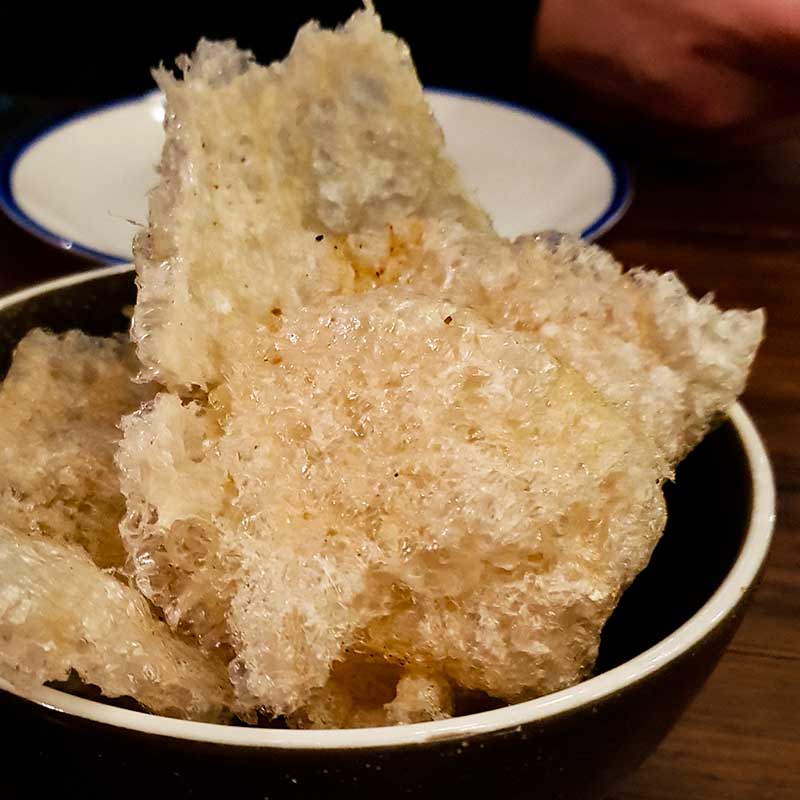 Meatmaiden Bar & Grill - Puffed Pork Scratchings with Spiced Salt.